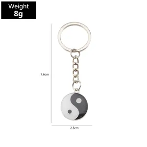 Yin Yang metal keychain with black and white drop oil pendant, classic cultural accessory detail.