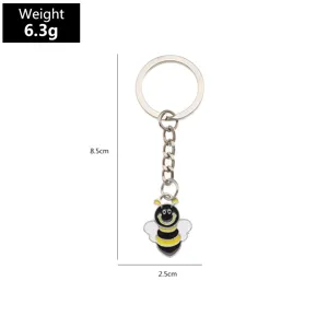 Metal alloy bee keychain detail view, cute insect keyring with dimensions 8.5x2.5cm.