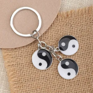 Yin yang taiji metal keychain with black and white drip oil pendants for daily use.