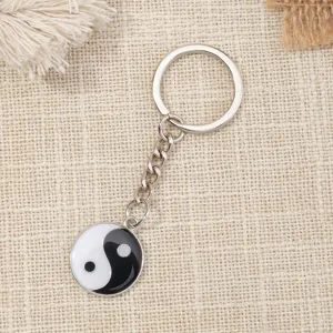 Detailed view of the metal Tai Chi symbol keychain, crafted with durable alloy and enamel.