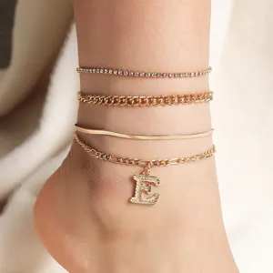 Layered gold anklet set with rhinestone chain and initial letter pendant for women summer beach.