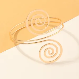 Gouden metallen geometrische spiraal bovenarm manchet armband, vintage open armlet sieraden.