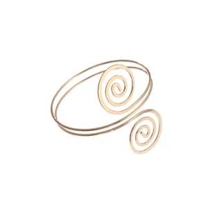 Gouden metalen spiraal armband bovenarm manchet geometrisch uitgeholde vintage sieraden