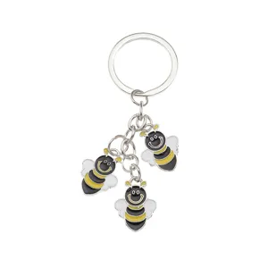Metal enamel bee keychain detailed shot showing three cute bee pendants and standard keyring.