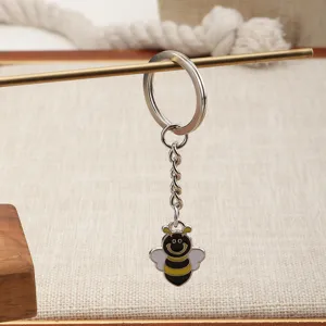Metal bee keychain detail view, cute enamel bee pendant with sturdy split key ring.