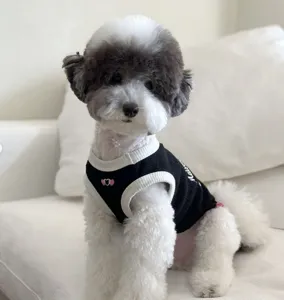 Breathable summer pet vest with cute heart embroidery for small dogs and cats comfortably.