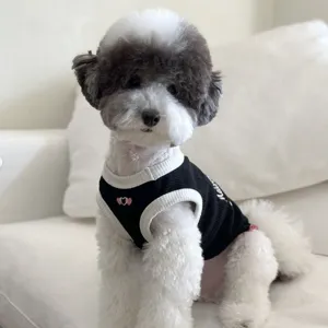 Breathable summer pet vest for small dogs and cats, cute black and white dog clothes.
