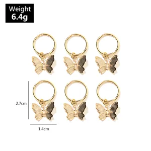 Goldene Schmetterling Haarbraende Ringe Detailansicht, stilvoller DIY Haarschmuck fuer Streetstyle.
