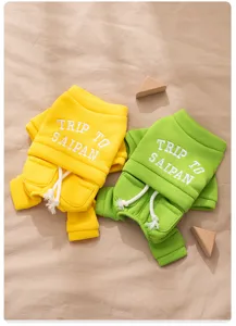 Dog winter hoodie four-leg warm pet clothes set with pockets and cute embroidery detail.