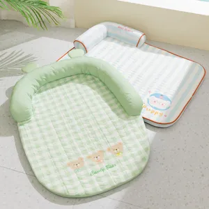 Cooling pet mat detail view, breathable dog bed with soft bolster, green check and blue stripe.