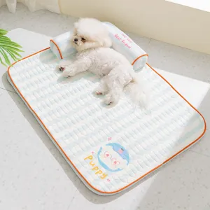 Cooling pet mat detail view featuring breathable blue and white stripes with a soft puppy pillow.