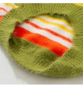 Close-up detail of warm fuzzy striped dog sweater for large pets, soft knit texture fabric.