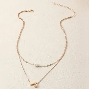 Elegante doppelte Goldkette mit Perlenanhänger und hübschem Buchstaben S Herz Anhänger.