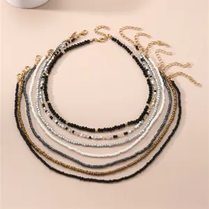 Exquisite bohemian beaded necklace set detail, showcasing multi-color layered clavicle chains.