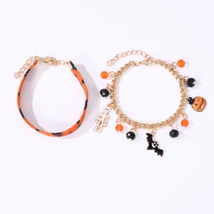 Set di bracciali di Halloween con cinturino in pelle arancione e ciondoli zucca pipistrello.