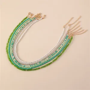 Bohemian multi-layer beaded necklace set featuring elegant green and white tones for women.