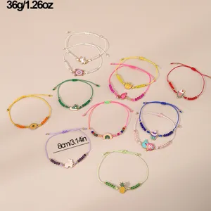 Bunte geflochtene Perlenarmbänder Set mit süssen Regenbogen, Meerjungfrau und Einhorn Anhängern.