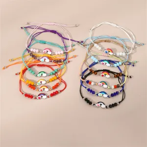 Bunte geflochtene Armbänder Set mit süßen Regenbogen Wolken Anhängern Perlen Schmuck.