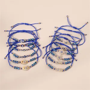 Blaues Auge geflochtenes Charm Armband Set mit Metallperlen und funkelnden Kristall Buchstaben.