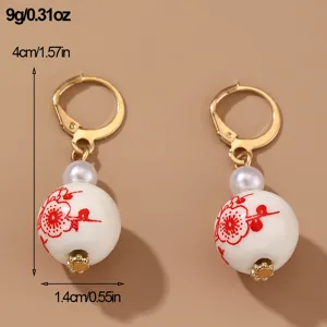 Vintage Chinese style ceramic floral earrings with gold-plated leverback and pearl accents.
