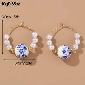 Blue and white porcelain pearl hoop earrings detailed view, showing elegant vintage style.