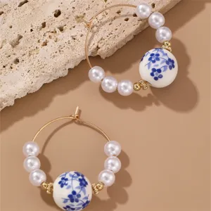 Retro blue and white porcelain pearl hoop earrings for women, vintage Chinese style jewelry.