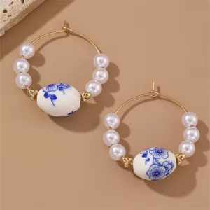 Vintage Chinese style blue and white porcelain pearl hoop earrings for elegant women.