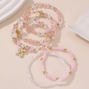 Rosa Perlenarmband Set mit süsser Schleife, mehrlagiger Kristalldschmuck für Damen.