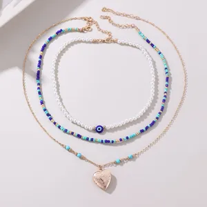 Mehrlagige Perlen Perlenkette Set mit Evil Eye und Herz Anhänger Damen Modeschmuck Accessoire