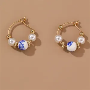 Vintage blue and white porcelain pearl hoop earrings, elegant retro Chinese style jewelry.