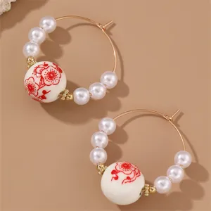 Vintage Chinese style pearl ceramic hoop earrings, elegant floral detail fashion jewelry for women.