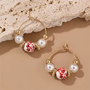 Retro Chinese style ceramic floral pearl hoop earrings detail view, elegant fashion jewelry.