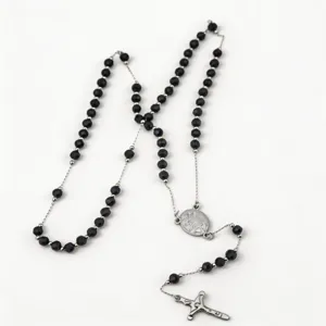 Black beaded long rosary necklace with silver crucifix and center medal vintage style