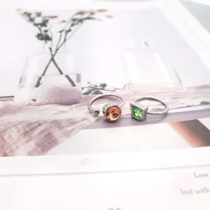 Titanium steel open knuckle ring with colorful crystal, minimalist daily jewelry detail.