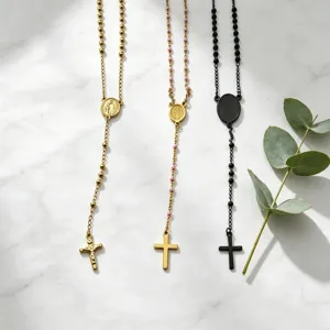 Stainless steel long bead cross pendant necklace set, stylish and versatile jewelry piece for women.