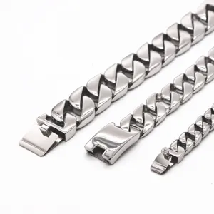 Stainless steel Cuban link bracelet detail, silver tone men thick chain jewelry close up.