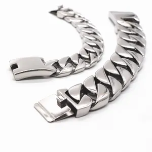 Detailed shot of polished stainless steel cuban link bracelets, showing smooth metal texture.