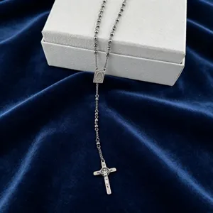 Stainless steel beaded rosary chain necklace with cross pendant, fine jewelry detail view.
