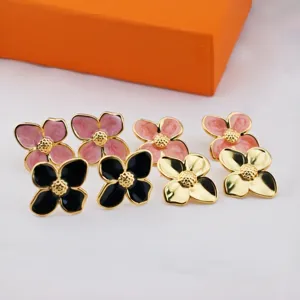 Chic French four-leaf flower stud earrings, elegant drip-glazed stainless steel jewelry for women.