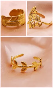 Gold open titanium steel leaf and feather rings detail, minimalist fashion jewelry design.