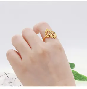 Detail shot of minimalist gold leaf open ring, elegant branch design for daily wear.