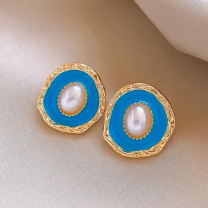 Vintage gold-plated oval pearl earrings with vibrant blue enamel, elegant retro design for women.