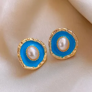 Vintage style blue oil drop oval pearl earrings, elegant gold-trimmed metal stud jewelry for women