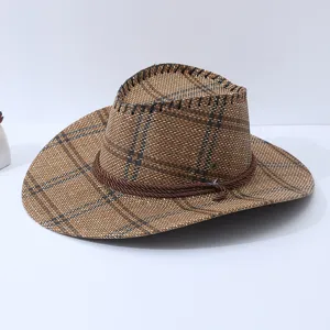 Detail shot of brown plaid cowboy straw hat, showcasing woven texture and decorative rope.