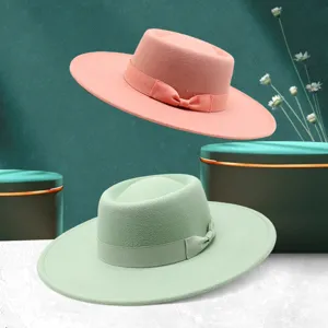 Detailed view of French elegant wool felt fedora hat, wide brim with cute bow detail for autumn.