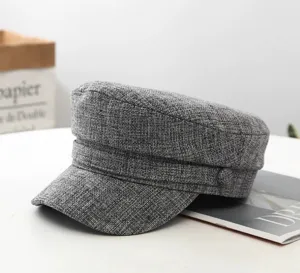 Grey linen military cap detail, stylish flat top design with side button, casual hat.