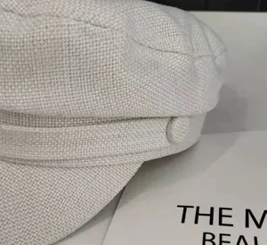 Detailed close-up of a stylish casual beige cotton-linen sailor cap, breathable texture.