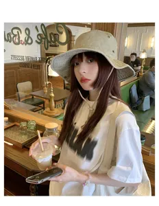 Washed vintage khaki fisherman hat for outdoor camping, sun protection and windproof design.