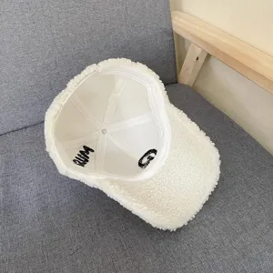 Plush sherpa baseball cap detail view, warm winter fleece hat with cozy interior embroidery.