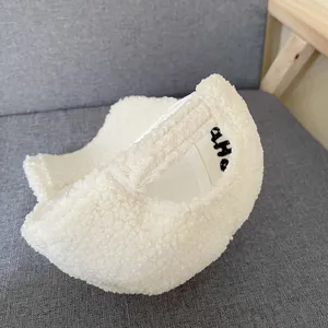 White sherpa baseball cap detail, cozy lamb wool texture, casual winter accessory for women.